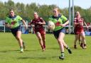 Anna Dennis scores a try against Leigh Leopards