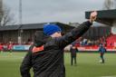 Sam Wilson salutes the travelling Rylands fans following Saturday's draw at Hyde United