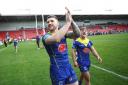 Connor Wrench applauds the Wire fans following the victory at St Helens