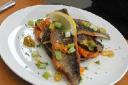 Pan seared sea bass with Mediterranean vegetables.