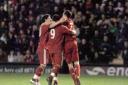 Liverpool's players celebrate Degen's opening goal