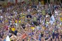 Warrington Wolves and Catalans Dragons fans cheering on their teams