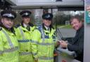 Sgt Joe Mullin, PC Gareth Yates, PCSO Steve Dodd with Charlie Shannon, operations director of Warrington Borough Transport     MBZ250108