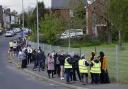 People queuing for Covid vaccinations at the ESSA academy in Bolton