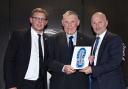 Colin Stanton, centre, receiving his Heart and Soul Award from Warrington Wolves Charitable Foundation director Neil Kelly, left, and Warrington's England cricket legend Neil Fairbother