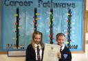 Bruche Primary pupils Lexi Shepherd and Charlie Sampson proudly display their school’s new Primary Career Mark award