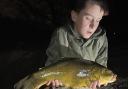 Ten-year-old Koree Finch with the personal-best tench he caught at Grey Mist on Saturday