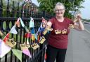 Diane Hughes with the knitted bunting at Vicarage Park (Dave Gillespie)
