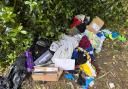 A pile of discarded belongings were found in Bruche park