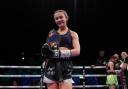 Rhiannon Dixon with her belt after beating Vicky Wilkinson for the Commonwealth lightweight title at M&S Bank Arena in Liverpool