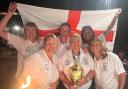 Helen Dagnall celebrates with her England teammates