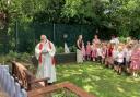 Schoolchildren at St Peter's in Woolston unveiled a bench dedicated to a beloved parish priest, Fr John Gildea