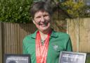 Judy Brown with her medals and record certificates