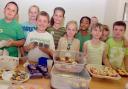 St Augustine’s pupils tuck into the sweet treats     MBA300911
