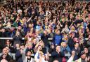 Warrington Wolves fans celebrate the victory at St Helens