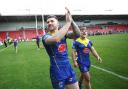 Connor Wrench applauds the Wire fans following the victory at St Helens