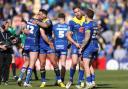 Relieved Warrington Wolves players celebrate at full time