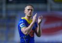 Ben Currie applauds the Wire fans following the win over Hull KR