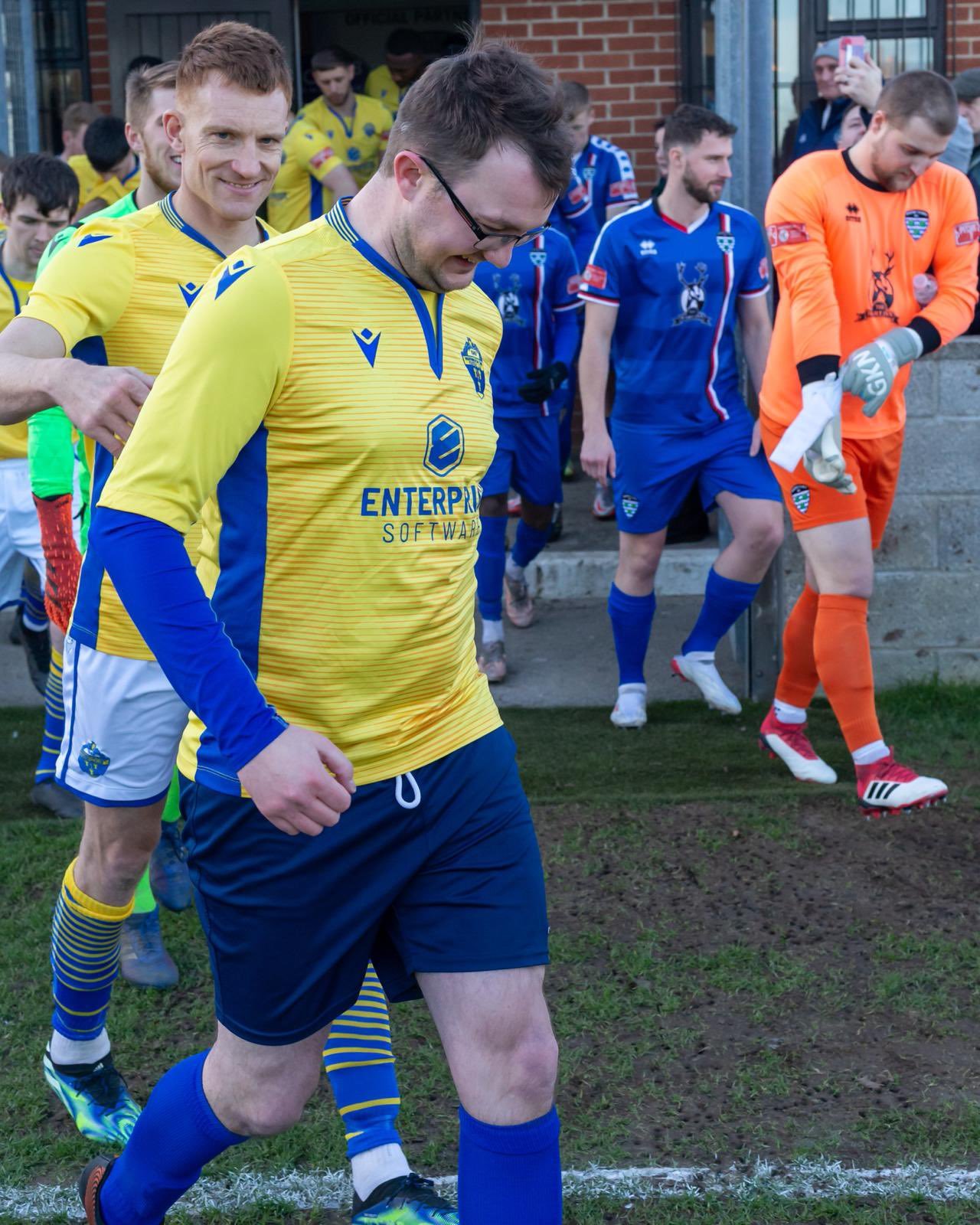 Tom leads the Yellows out at Whitby alongside captain Mark Roberts. Picture by Brian Murfield