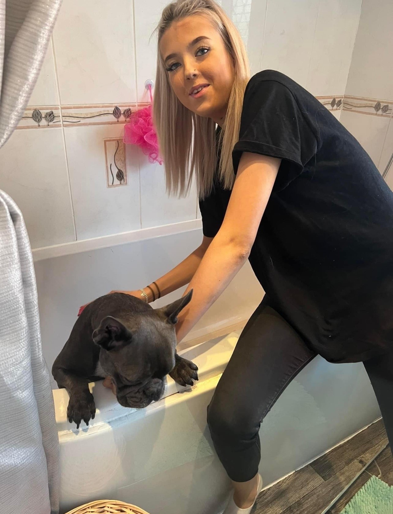 Elle sends photos and videos to customers so they can see their dogs enjoying their pamper session