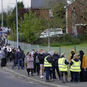 People queuing for Covid vaccinations at the ESSA academy in Bolton