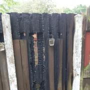 Firefighters urge caution after fire pit flames torch garden fence