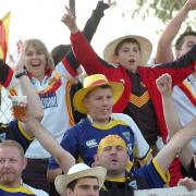 Warrington Wolves and Catalans Dragons watch the game together at the 2008 clash at the Gilbert Brutus Stadium