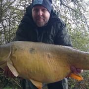 Darren Smith with his personal best 25lb mirror carp