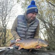 James Shimmon with the mirror carp he caught on his last cast at The Mount