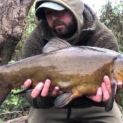 Jay Makin with one of the tench he caught at Grey Mist