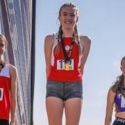 Centre, Esme Heavy, under 17s double Cheshire champion (1500m and 800m) and Hannah Hull, left, 1500m silver medal winner