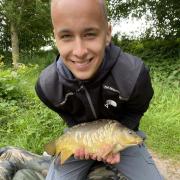 Sam Asson, 15, with a small carp from High Legh Fishery
