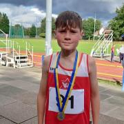 Club record holder Euan Lawton with his winner's medal