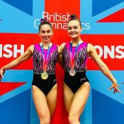 Wire Gymnastics Club's Mia Koll, left, and Millie Simpson with their British Championship medals