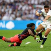 England's Alex Mitchell is tackled by Fiji's Simione Kuruvoli during the Rugby World Cup quarter-final in Marseille on Sunday