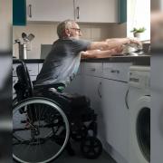 Alan Walker, who had his right leg amputated, says that he has been left waiting three years for an adapted kitchen to be fitted