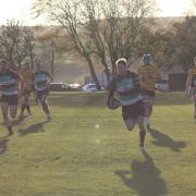 Lymm's Andy Rowley on his way to scoring against Sheffield Tigers