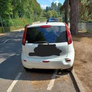 A car parked illegally on zig-zag lines at Lymm Dam