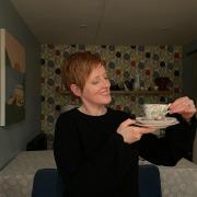 Jen Perry with one of the vintage china cup and saucer sets
