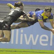 Matty Ashton dives over for the second of his three tries