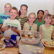 St Augustine’s pupils tuck into the sweet treats     MBA300911