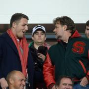 Current Wire coach Sam Burgess with Russell Crowe in St Helens in 2015. Picture: PA