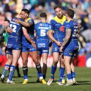 Relieved Warrington Wolves players celebrate at full time