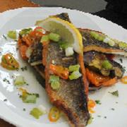 Pan seared sea bass with Mediterranean vegetables.