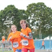 Denise Zachariasz ran the half marathon and then completed the mile with daughter Katie