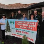 St Rocco's staff and volunteers celebrating the collection