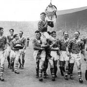Raised on the shoulders by teammates after Challenge Cup final win in 1950