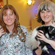 Manager Deborah Wareing with snake and Anna Mercer with Jethro the skunk PH_1984001