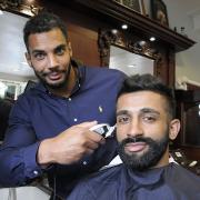 Ryan Atkins gave Aran Dhillon a trim to remember Photo by Mike Boden