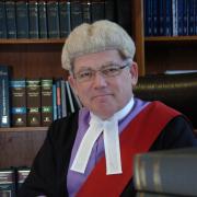 Judge Teague in the court library